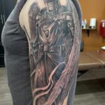 Angel tattoo of St. Michael in armor
